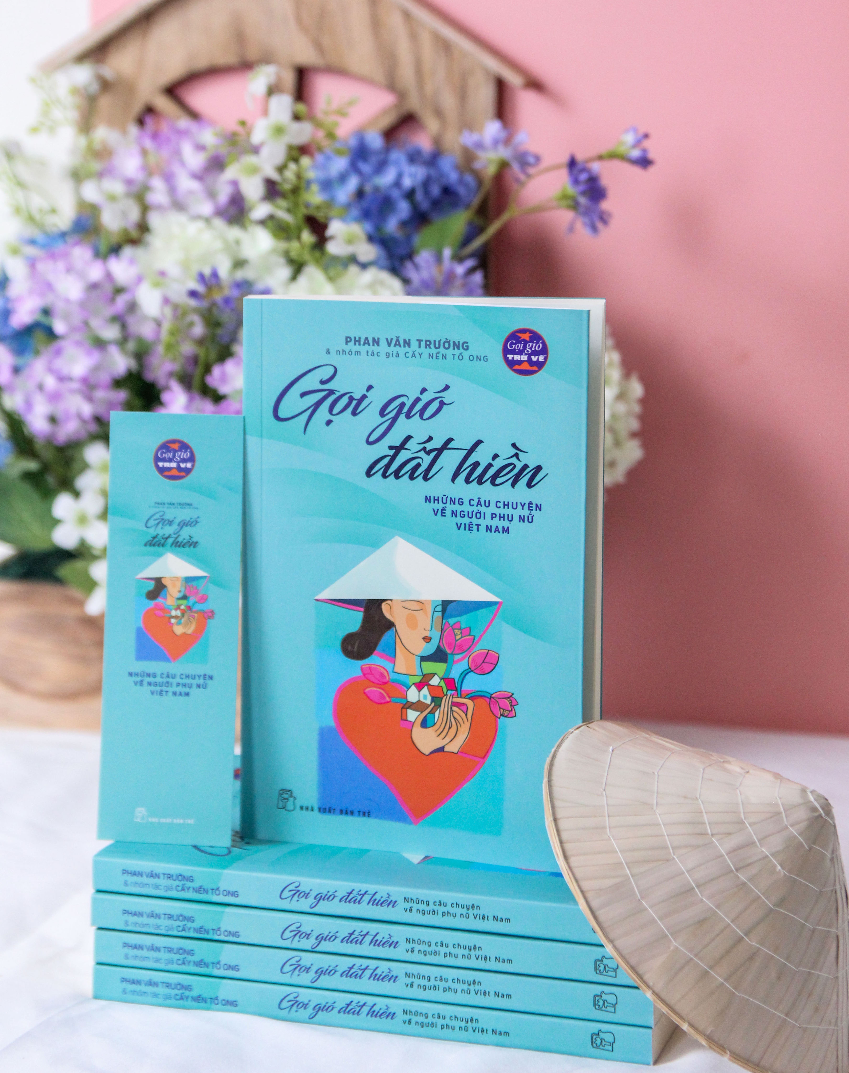 A render of three white cylindrical columns, against a warm creme background